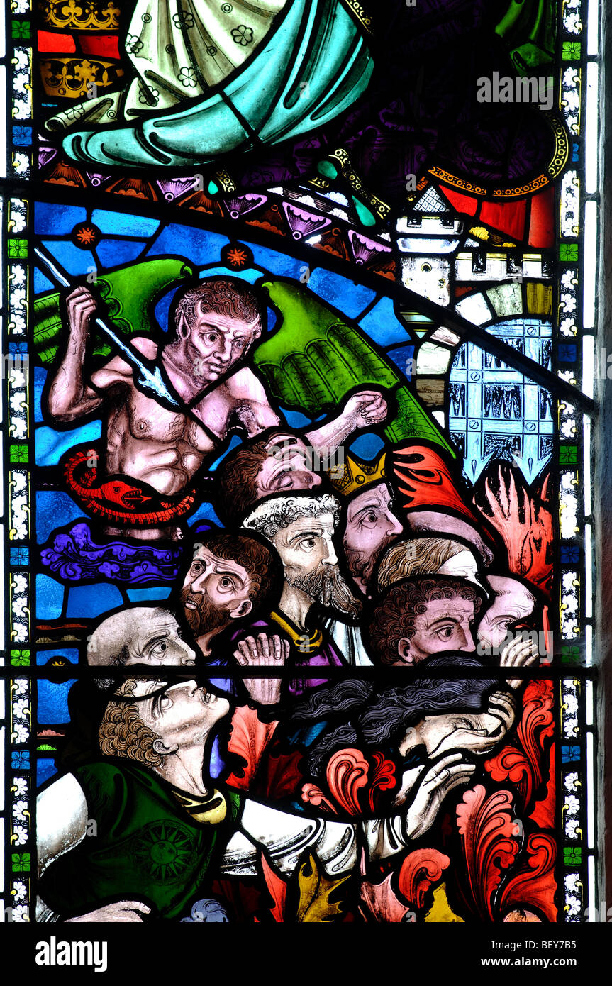 Stained glass depicting Hell, St. Mary`s Church, Kempsford, Gloucestershire, England, UK Stock Photo